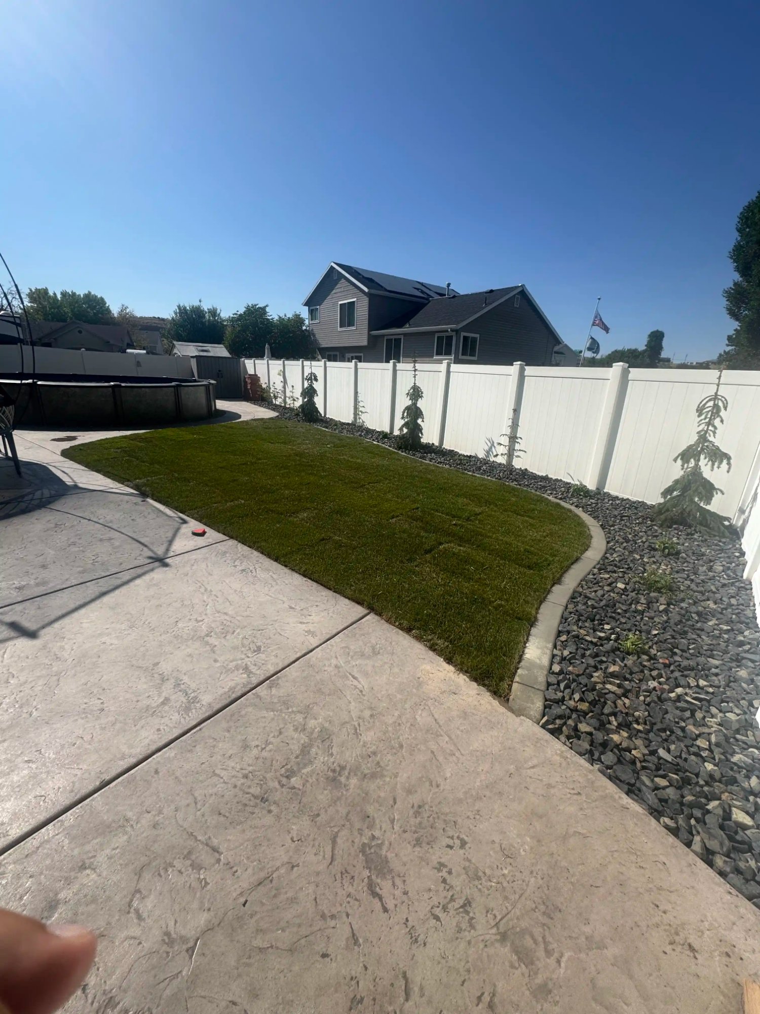 HOA community grounds landscaping with sod and rock border Utah